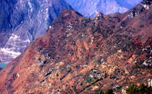 <p>Houses on a mountainside devastated by the recent 6.5-magnitude earthquake, which killed more than 600 people in Ludian county, Yunnan province. (Image by Yang Yong)</p>