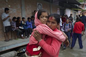 mother holding daughter, earthquake in Nepal April 2015