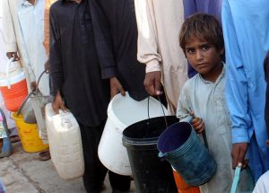 <p>A young boy at a PDI (Participatory Development Initiative) water distribution via tankers in the city camps. Oxfam&#8217;s partner (PDI) team began districbuting water in about 30 temporary camps in the flood effected areas since the day people started to arrive in the cities.</p>