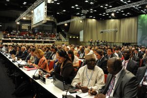<p>Negotiators at UN climate talks who usually operate in blocs with other countries (Image by UNFCCC)</p>