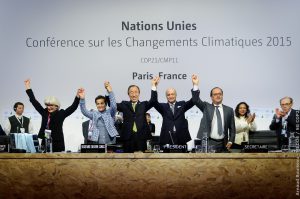 <p>UN Secretary General and others celebrating the agreement at COP21 [image by Arnaud Bouissou]</p>