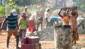 <p>Workers building a road in Goa. (Photo by Ian D. Keating)</p>