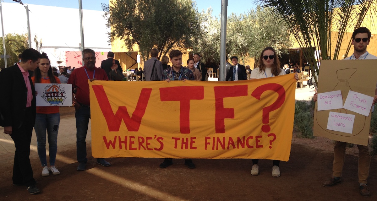 <p>At the UN climate summit in Marrakech, Morocco, activists protest about the lack of finance from rich to poor nations to help cope with climate change (Photo: Joydeep Gupta)</p>
