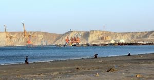 <p>As Gwadar develops in the background, the fisherfolk of Gwadar seem to have no space [image by: Zofeen T Ebrahim]</p>