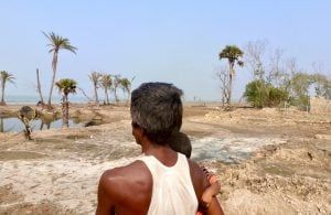Man and his child walking through Sundarbans