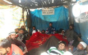 <p>A group of villagers on hunger strike in opposition to the Bursar dam [image by: Shafiq Malik]</p>