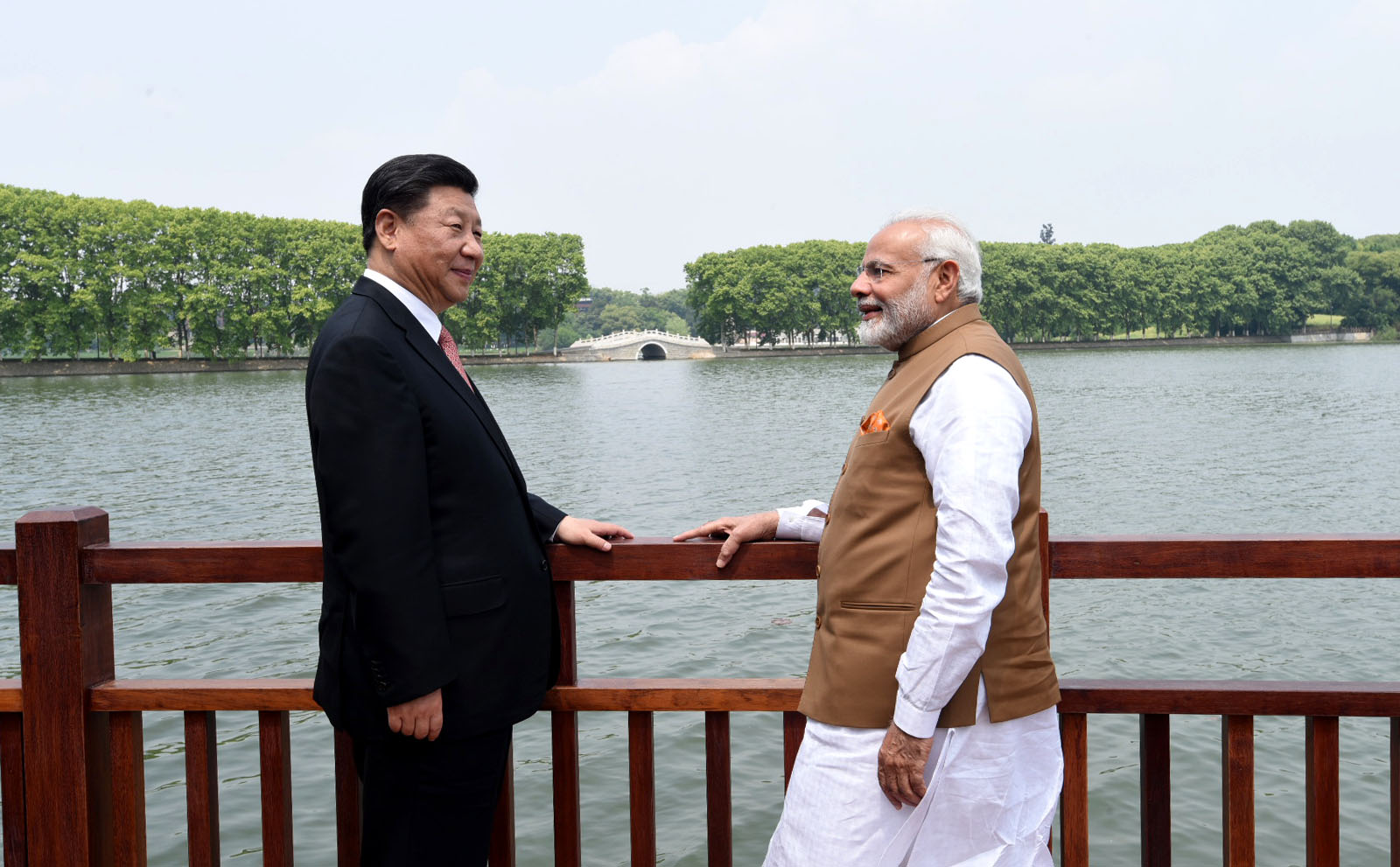 Narendra Modi and Xi Jinping standing along the East laKE