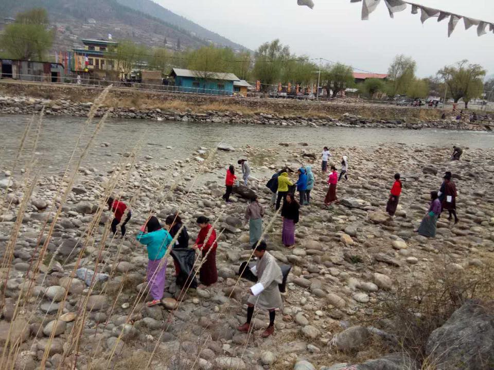 Residents collecting waste on river banks in Bhutan