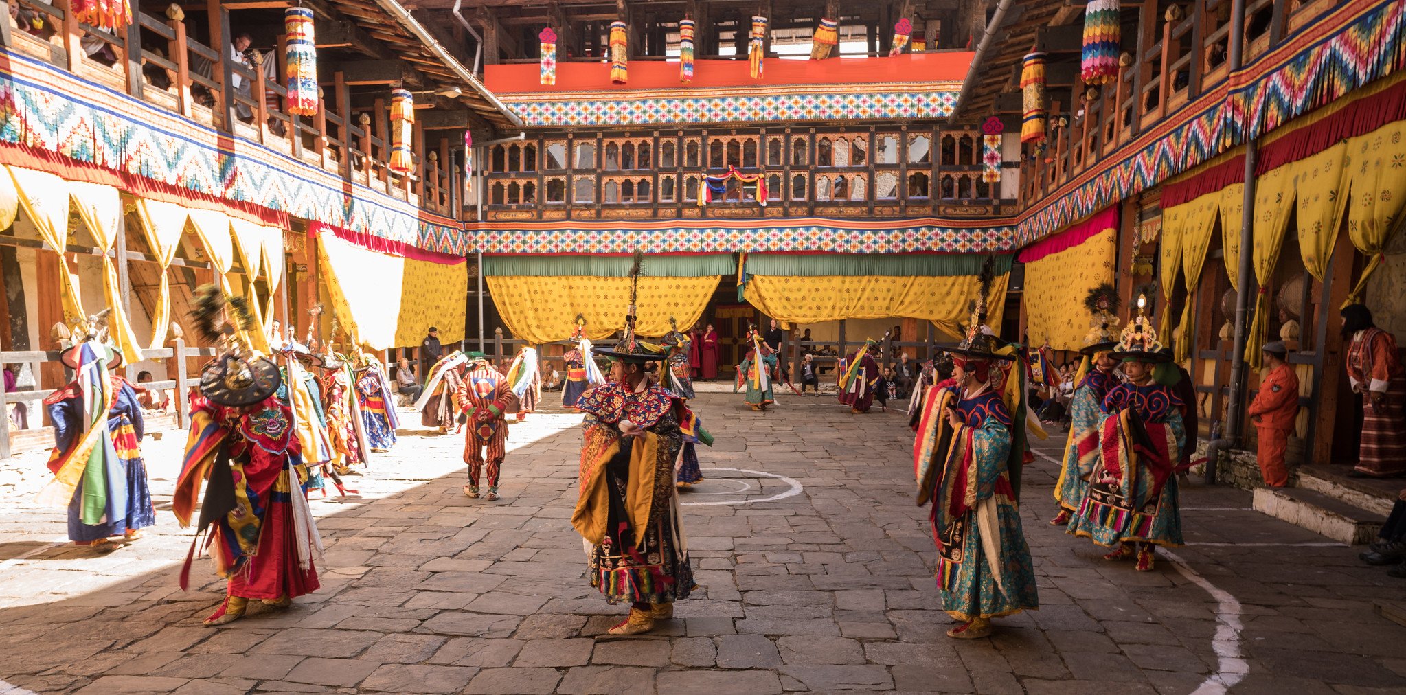 <p>Festival in Bhutan, Image source: Adam Singer</p>