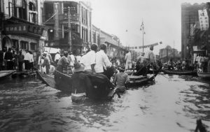 Rickshaw pullers working the flooded streets during 1931 China flood