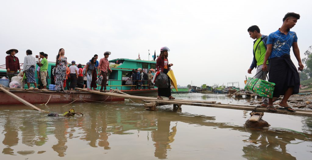 Passengers and goods leaving a ferry pier on the Chindwin River in Khamti town