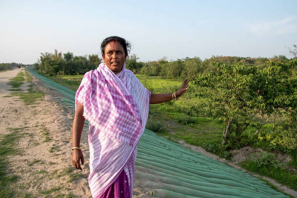 Aruna Das pointing to where the embankment breached during the floods of 2017 in Joinpur, North Lakhimpur, Assam [image by: Shailendra Yashwant]