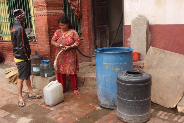 A woman selling water in Patan of Kathmandu valley