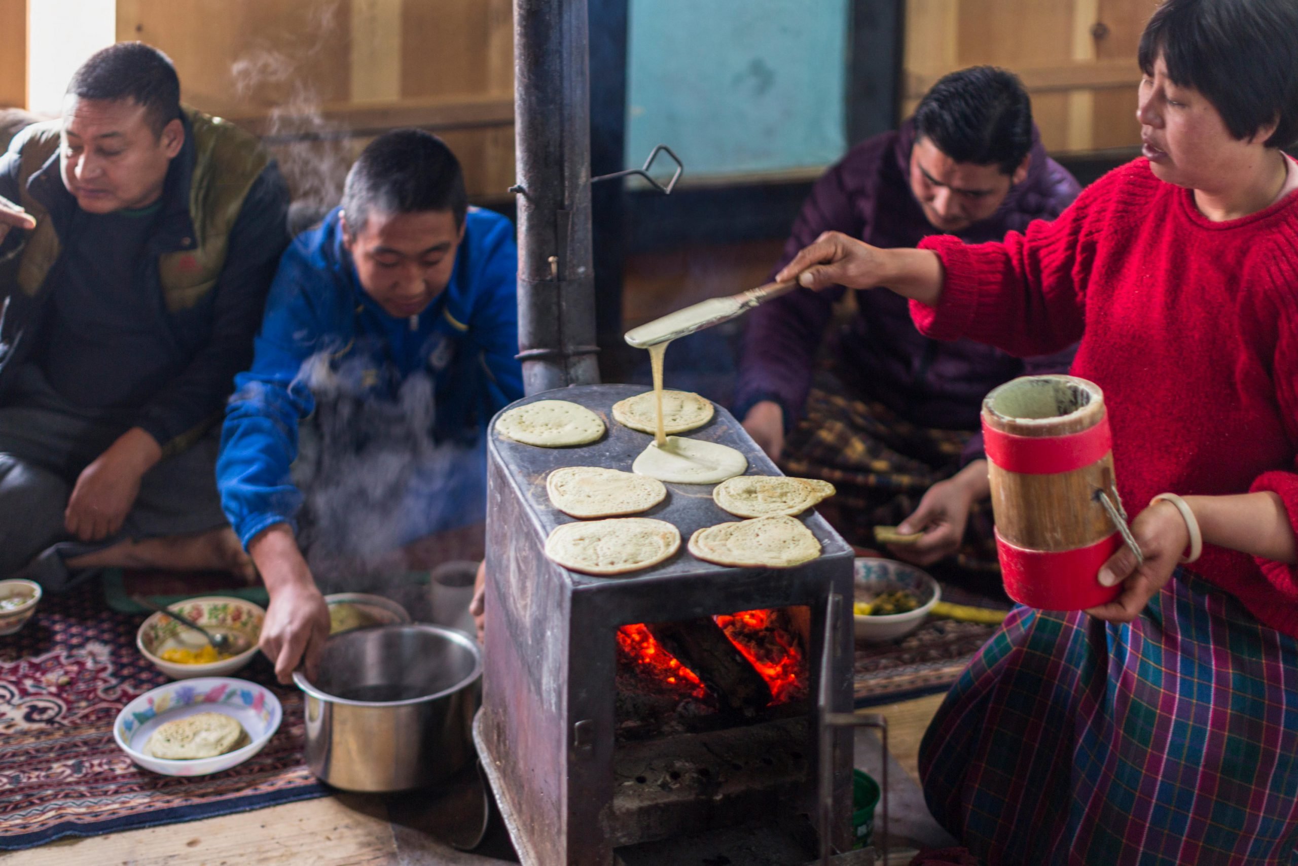 Bhutanese family using an electric stove