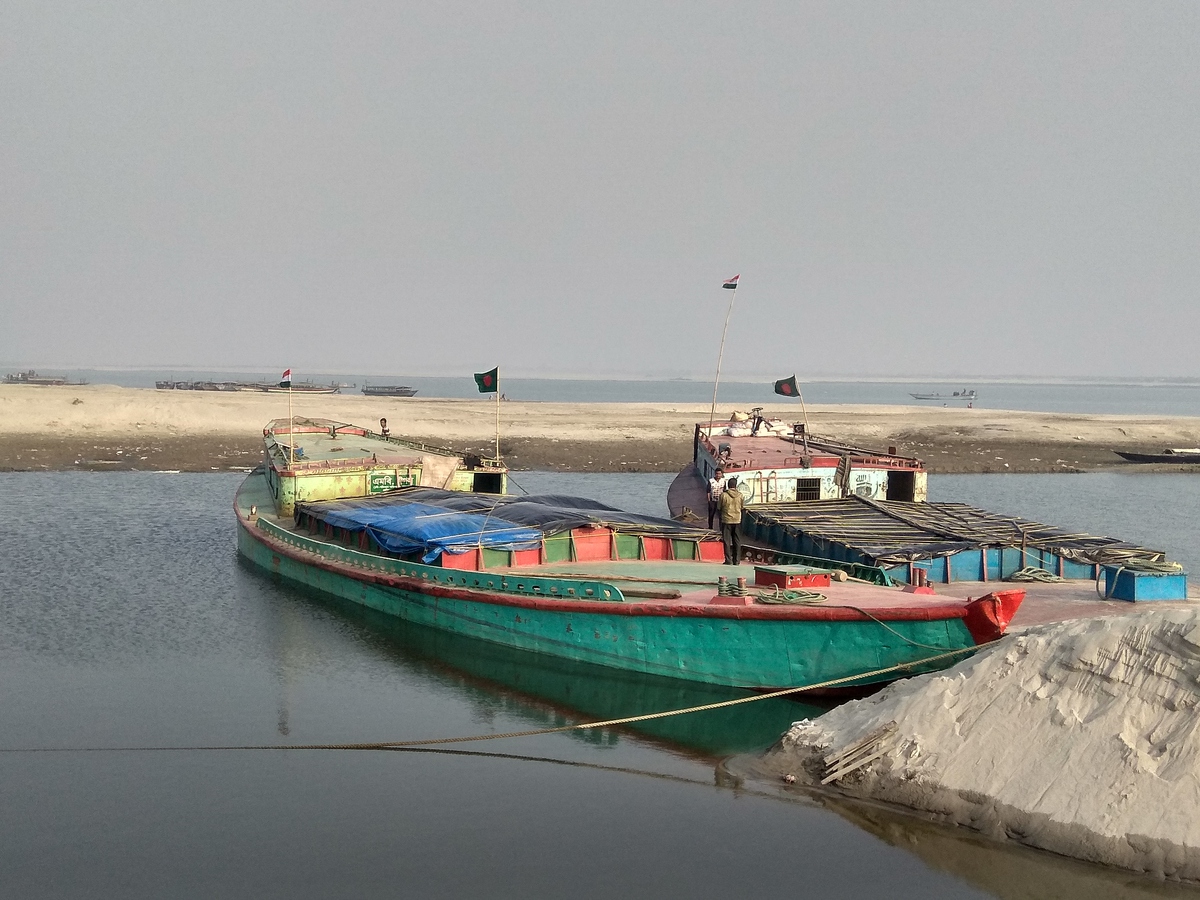 Bangladeshi barges loaded with stone chips at Dhubri
