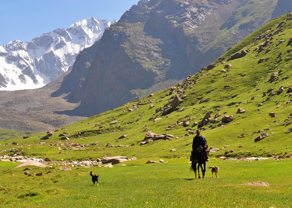 Community leader riding his horse in an alpine valley in the Tian Shan mountains. This valley is now situated in the recently established and community-operated Babson Micro Reserve in Ton District [image courtesy: Marc Foggin]