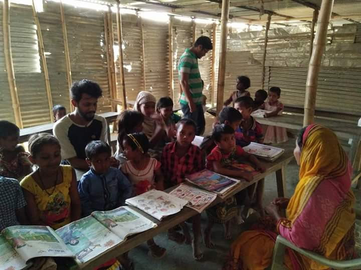 Educational volunteers from the Assam library conducting remedial classes for flood-affected children of the char in the government school (after school sessions) [image by: Abdul Kalam Azad]