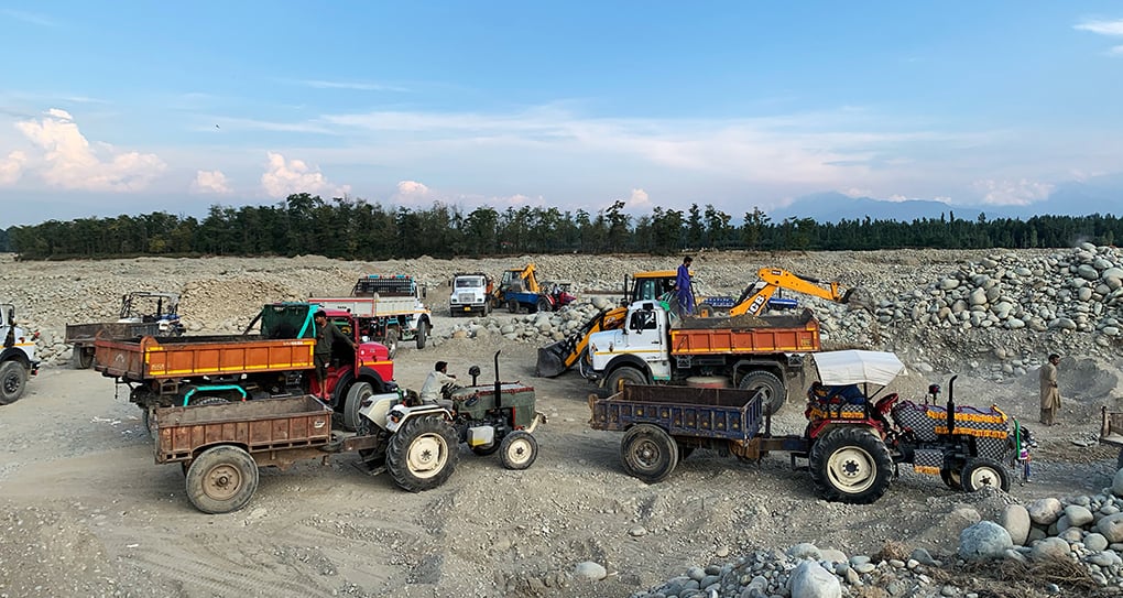 <p>Residents near the Rambi Ara, a tributary of the River Jhelum in Tahab, Jammu and Kashmir, say truckloads of minerals are being extracted from the river every day [image by: ShabirBhat]</p>