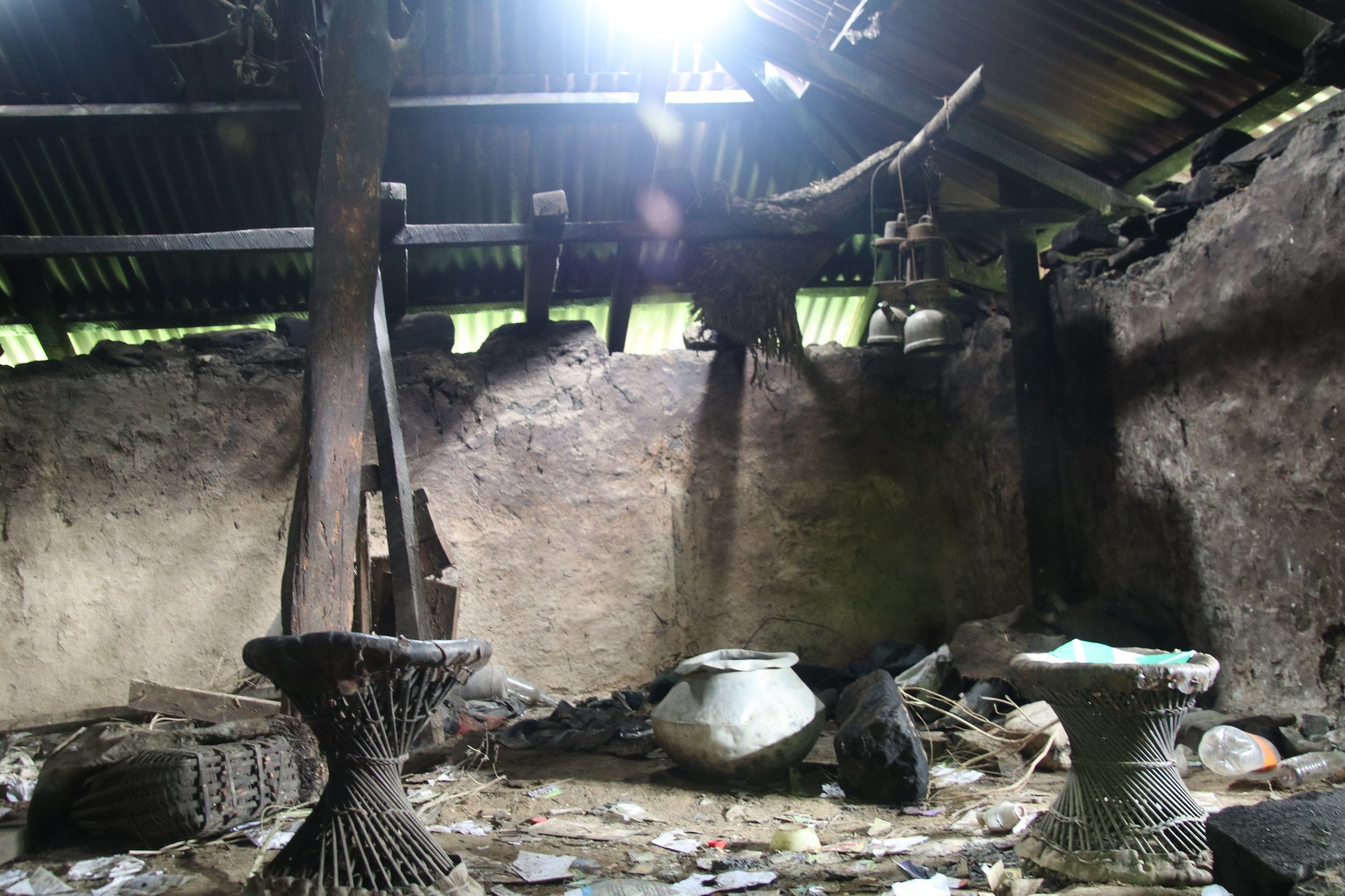 A pot and a few bamboo chairs left inside a gungtong at Tashiding, Dagana