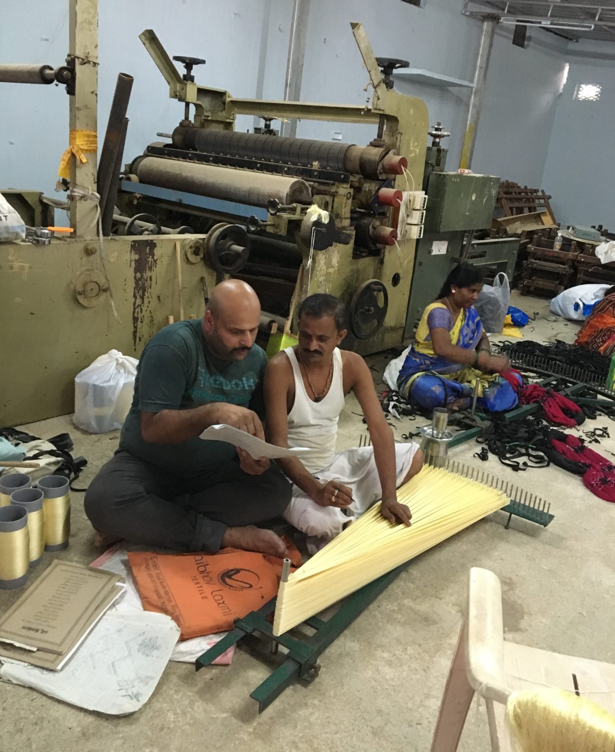 Designer Gautam Gupta (left) and a weaver working with banana yarn in Gupta’s workshop