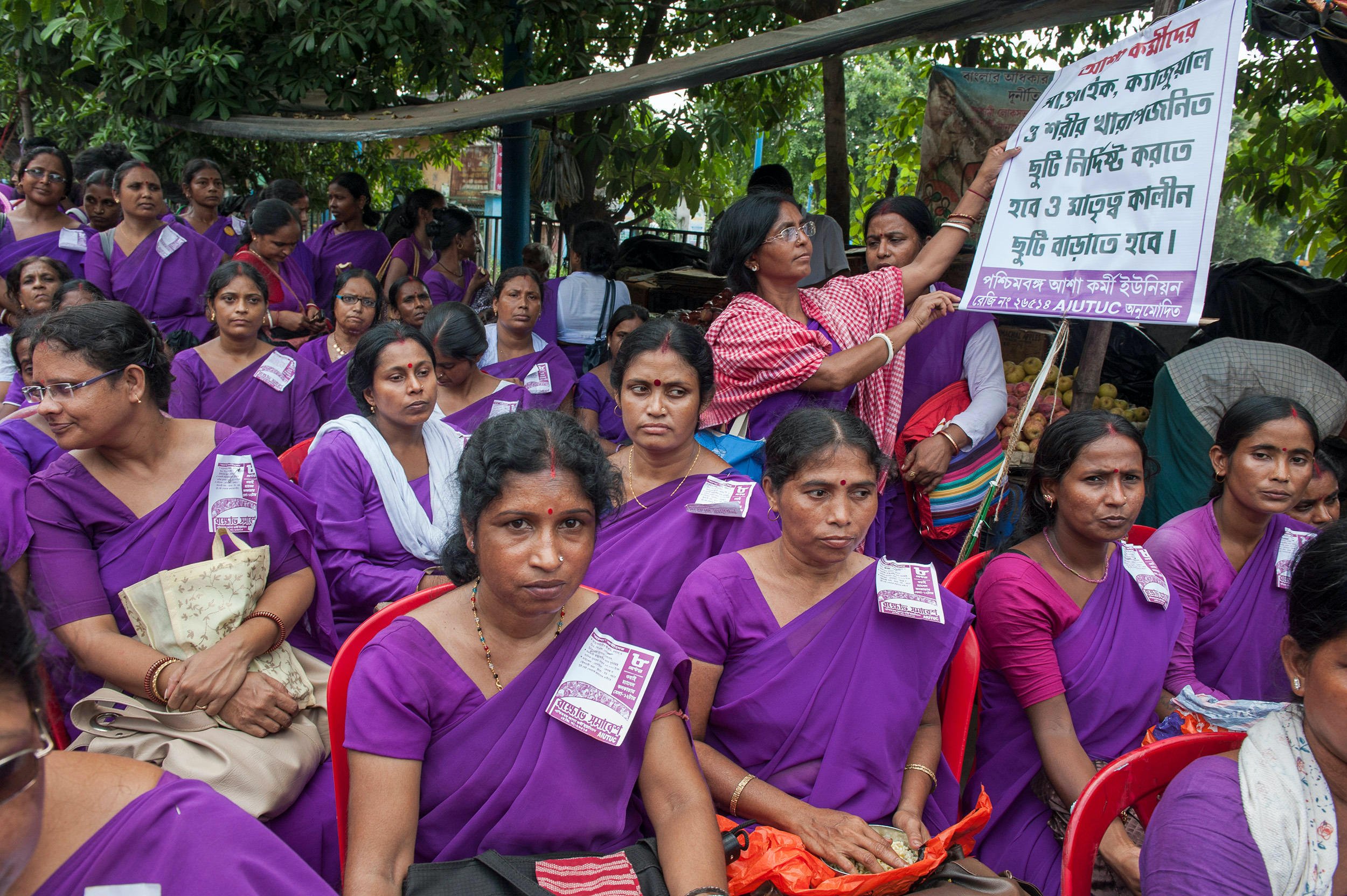 ASHA workers attend a rally demanding higher salaries in Kolkata