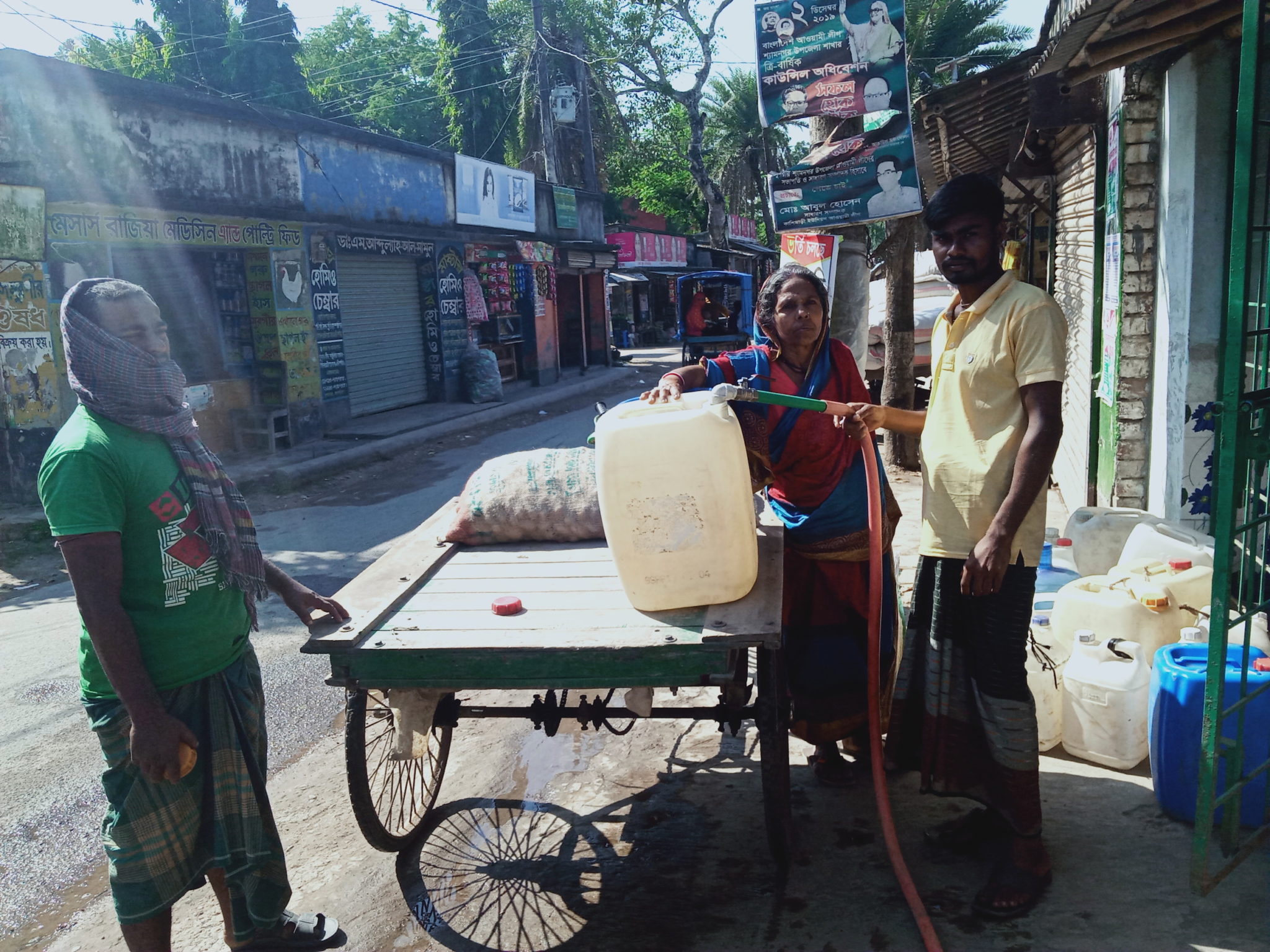 <p>Brajasundari buys water, a new experience in previously water-abundant Bangladesh, where salt water intrusion is affecting water sources [Image by: Riyan Talha]</p>