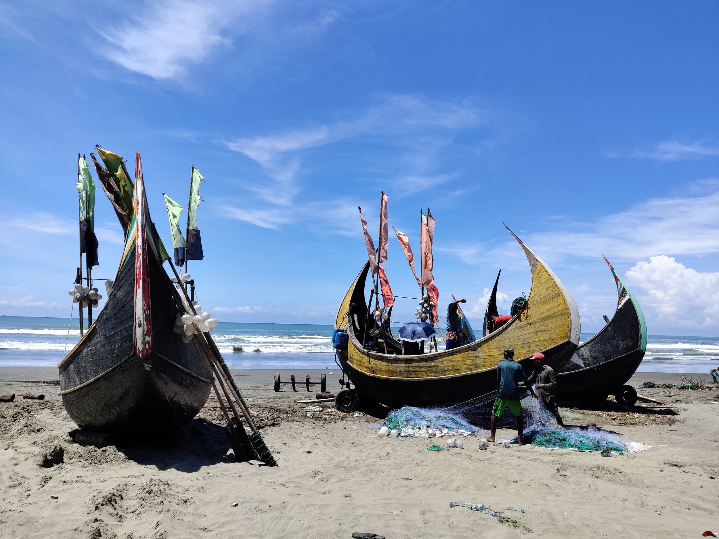 In the southeastern corner of Bangladesh, boats lined up at the Holbonia fishing harbour, notorious as the starting point of illegal voyages to Malaysia by trafficked Rohingya refugees [Image by: Nazmun Naher Shishir]