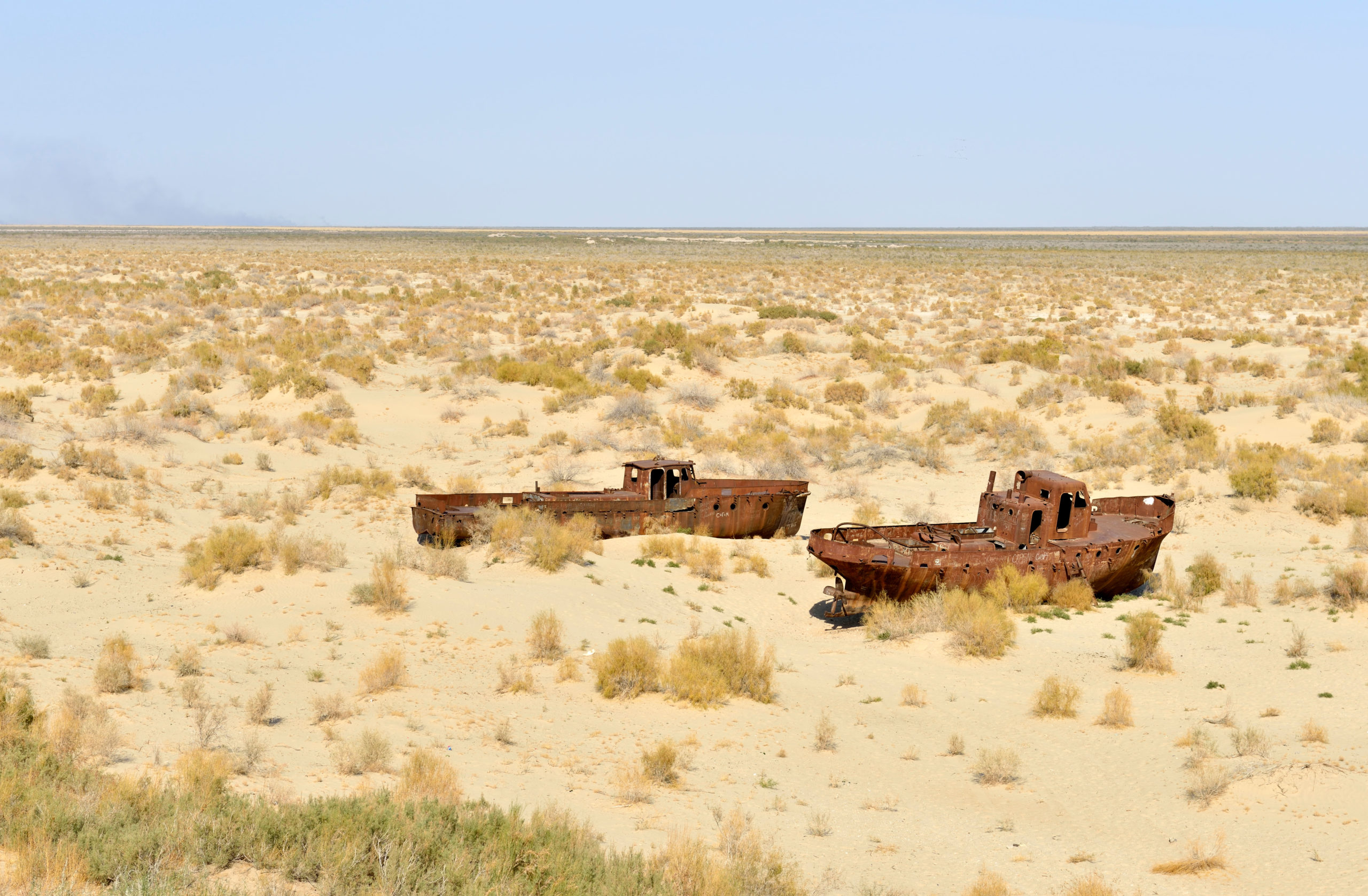 <p>Rusting ships on dry land that used to be the bed of the Aral Sea, near the town of Moynaq, Uzbekistan. Moynaq was formerly a busy fishing port (Image: Kasia Nowak / Alamy)</p>