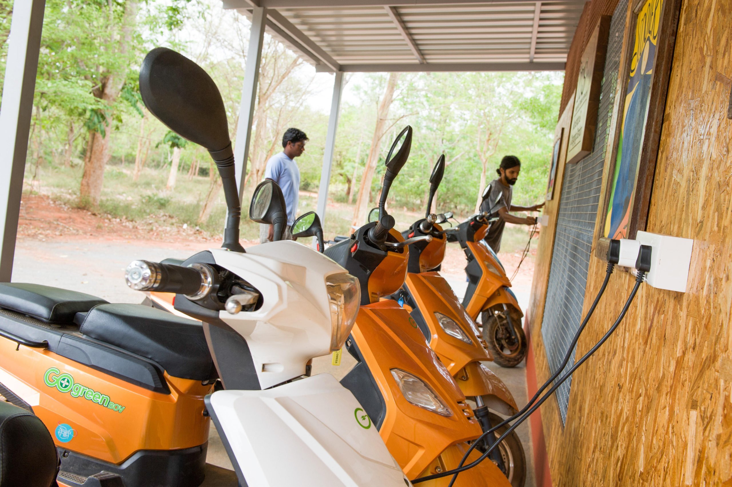Electric scooters being charged in Auroville, Tamil Nadu, India