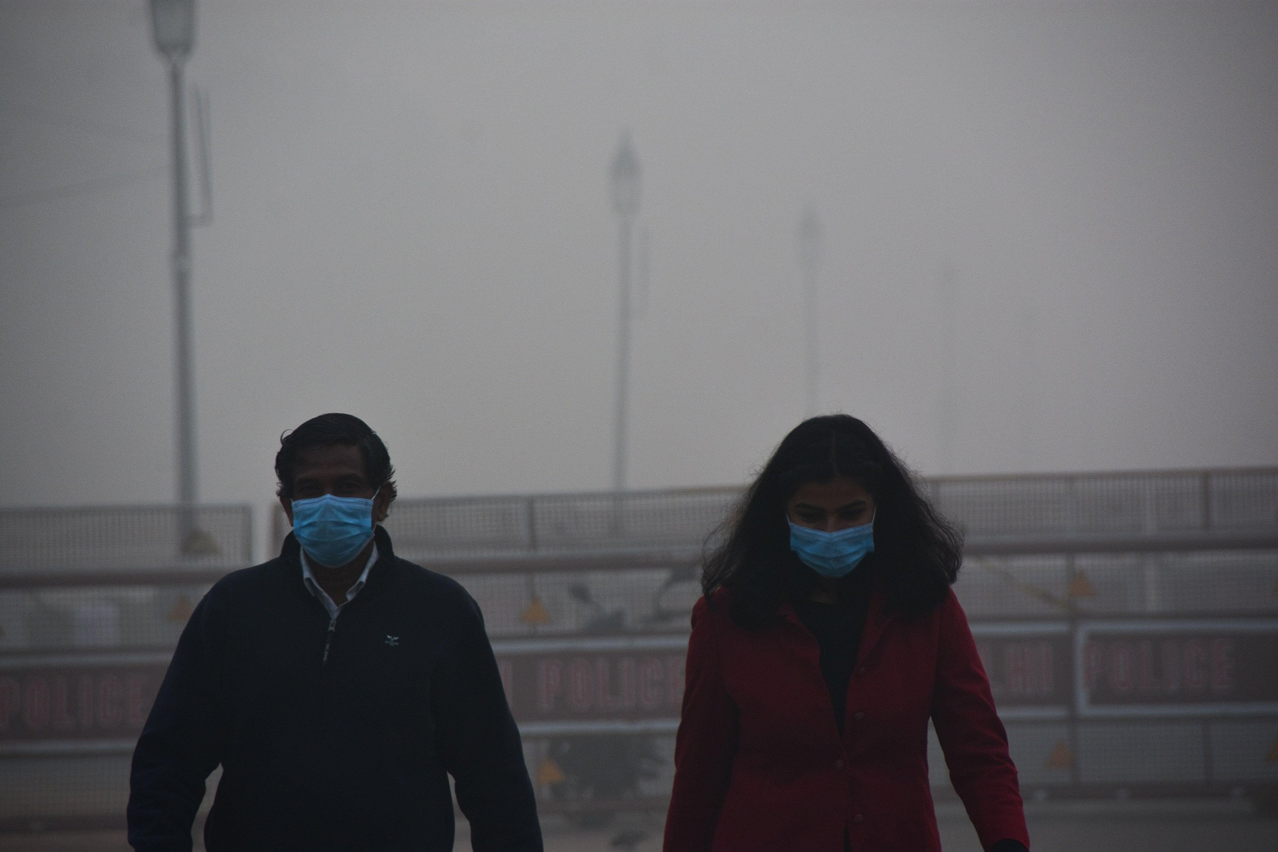 <p>Morning walkers masked against the Covid-19 virus and the smog near India Gate in New Delhi in November 2020 (Image: Manish Rajput/SOPA Images via ZUMA Wire/Alamy)</p>