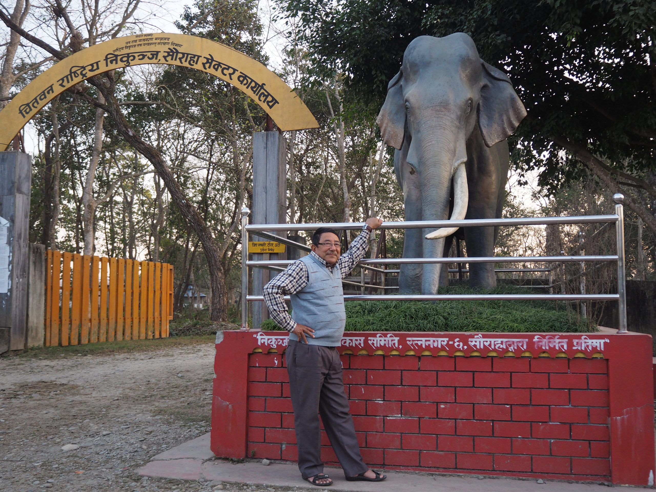 Bishnu Lama, a semi-retired wildlife technician, in front of the park office at Sauraha (Image: Peter Gill/The Third Pole)