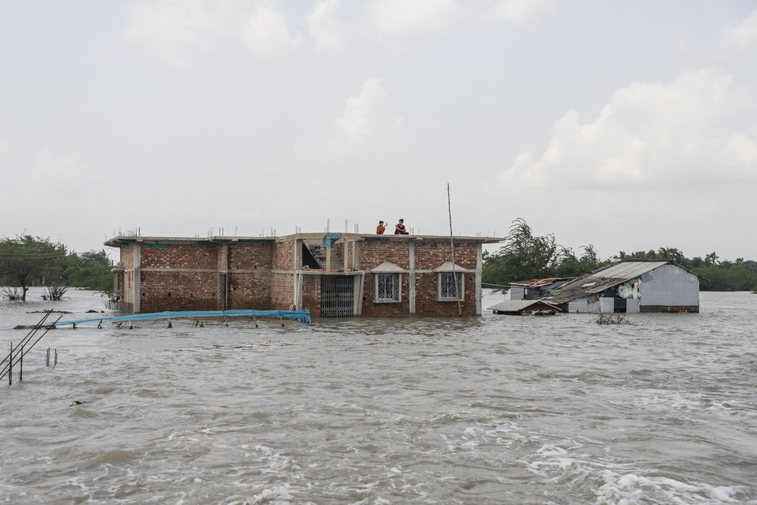 <p>Dhamakhali, a flooded coastal village in West Bengal, India, on 28 May 2021. The latest IPCC report says such flooding will become more frequent and more severe due to climate change. (Image: Alamy)</p>