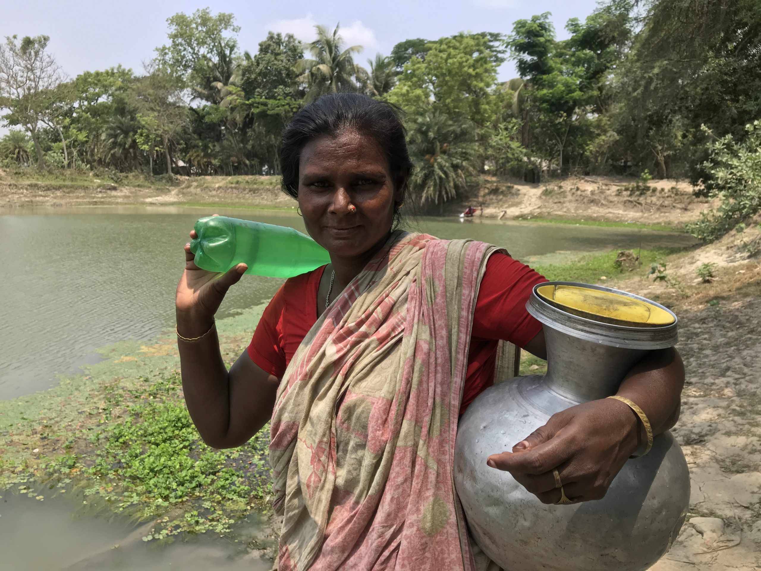 Shefali Biswas is returning home after collecting water from a pond
