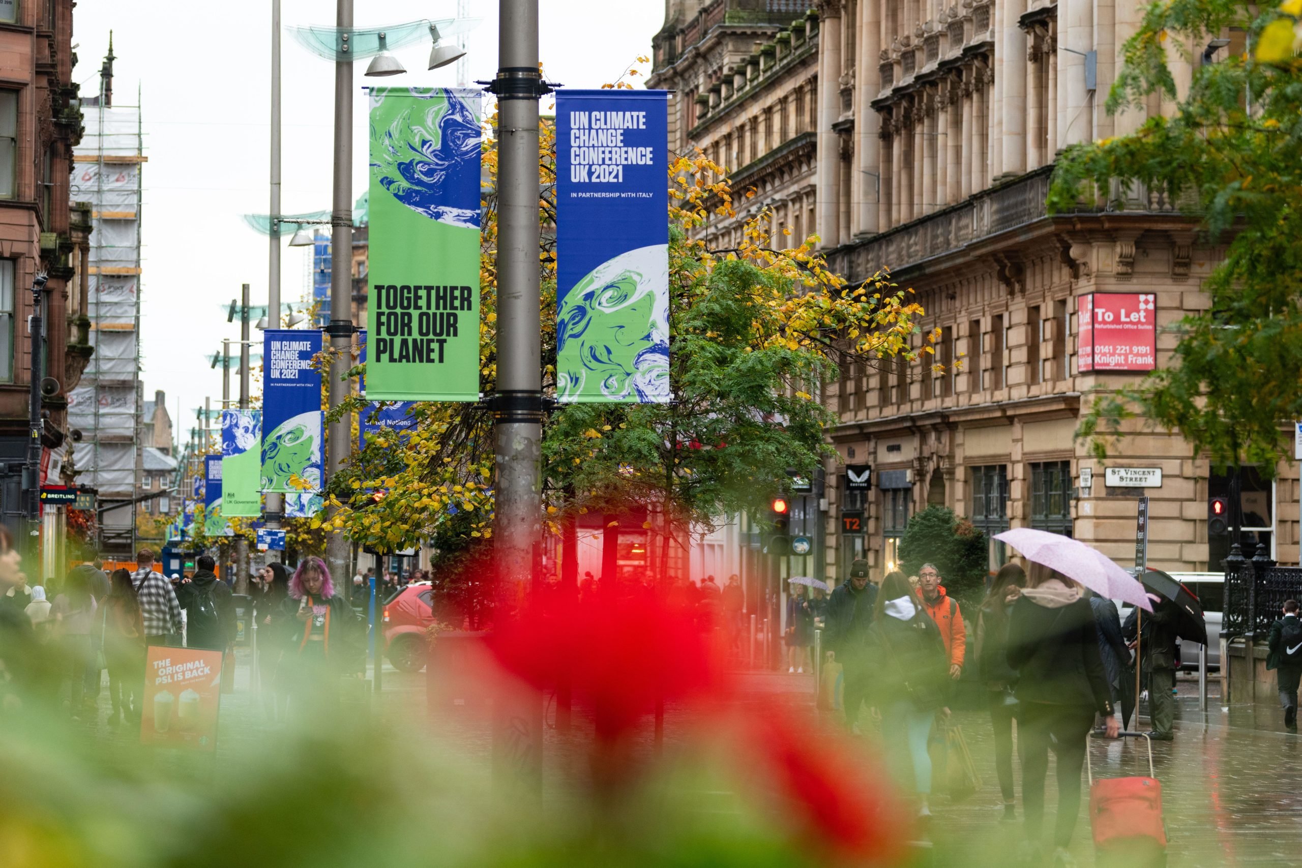 <p>Signs in Glasgow, UK, for the COP26 UN Climate Change Conference (Image: Kay Roxby / Alamy)</p>