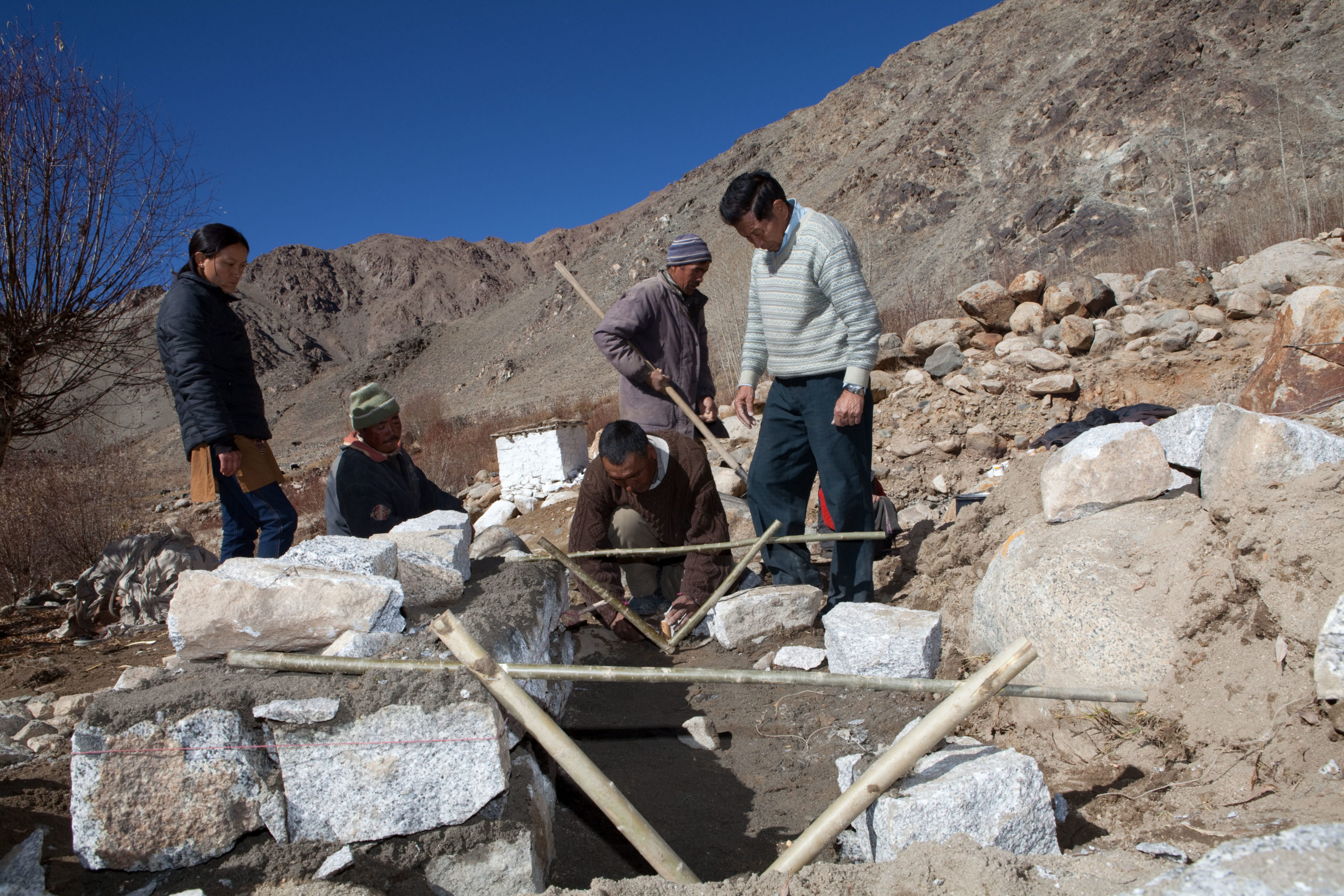 Chewang Norphel (R) at his artificial glacier project, adapting to glacier retreat. He has 10 projects in the region to bring water to local villages (Image: Emma Stoner / Alamy)