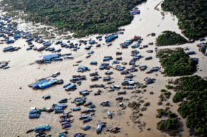 <p>An aerial view of a floating village on the Tonle Sap lake in Cambodia (Image: Alamy)</p>