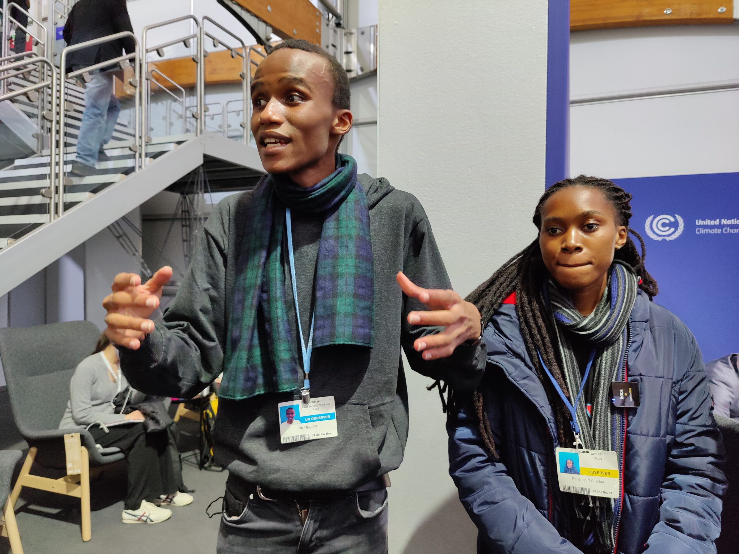 Youth at COP26. Eric Njuguna (left) from Kenya, Patience Nabukalu from Uganda said they were angry and disappointed at how COP26 panned out. (Image: Disha Shetty)