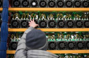A Bitcoin mine in Quebec, Canada. Creating new coins is highly energy-intensive, requiring hundreds of specialised computers to run almost 24/7. (Image: Christinne Muschi / Alamy)