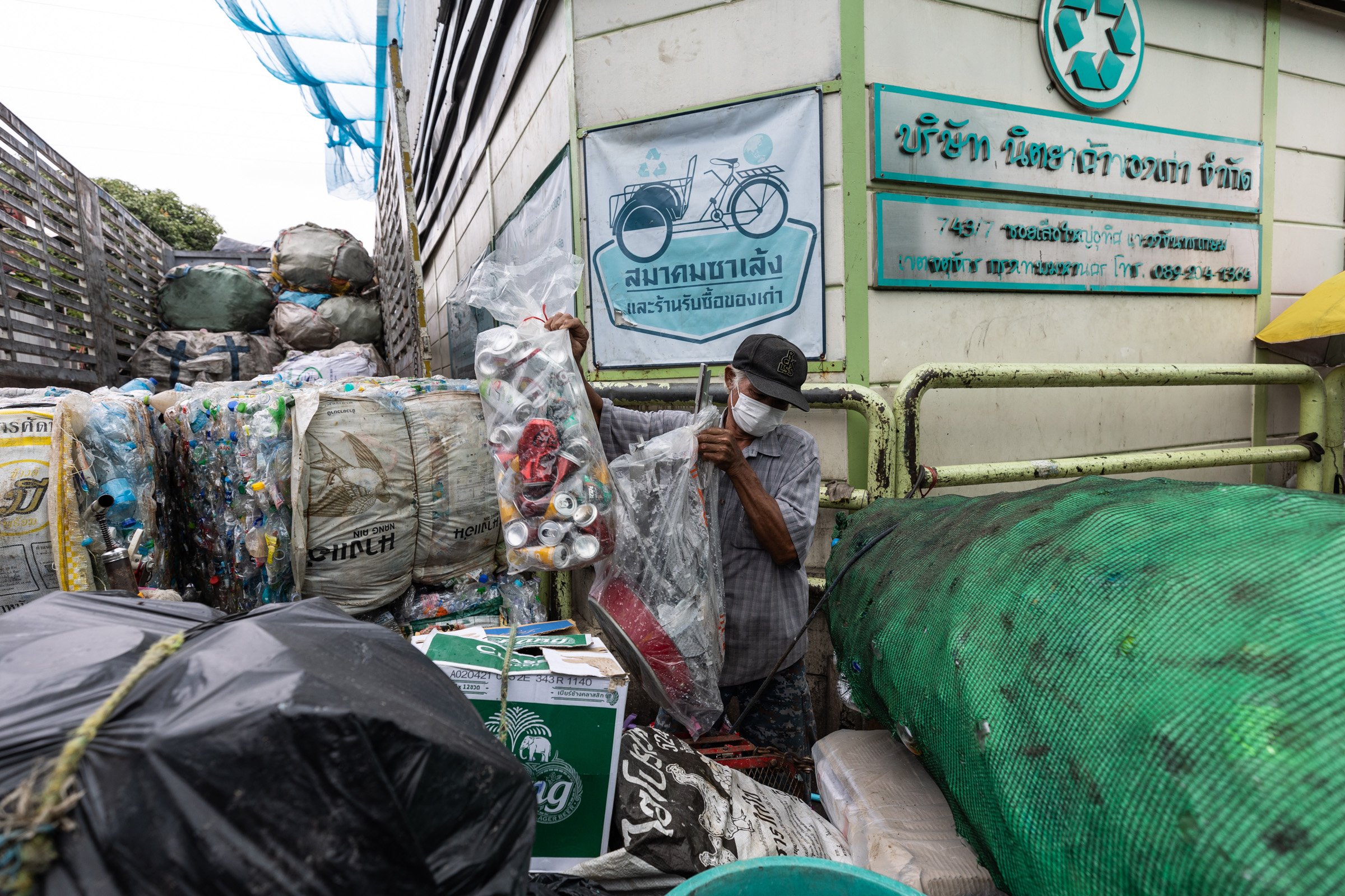 A saleng driver unloads his collected waste in Bangkok, Thailand, Luke Duggleby