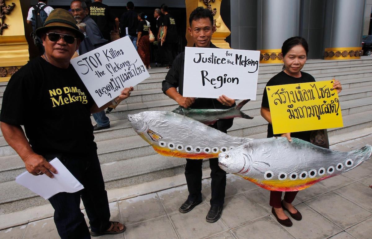 <p>People protest against the Xayaburi dam outside the Administrative Court of Thailand in Bangkok, in June 2014. Thai civil society has had more success changing water resource management than campaigners in other Lower Mekong Basin countries. (Image: Chaiwat Subprasom / Alamy)</p>