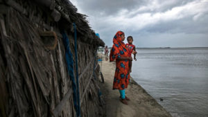<p>Ruksana Akter, 25, watches as Cyclone Yaas approaches Bangladesh’s coast in May 2021 (Image: Zakir Hossain Chowdhury / TNH)</p>