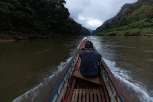 <p>Singkharn Ruenhom travels along the Yuam River in northwest Thailand. Located where the Yuam and Ngao rivers meet, his village of Mae Ngao is destined to mark the start of a controversial tunnel to divert water to the country’s central plains. (Image: Luke Duggleby / The Third Pole)</p>