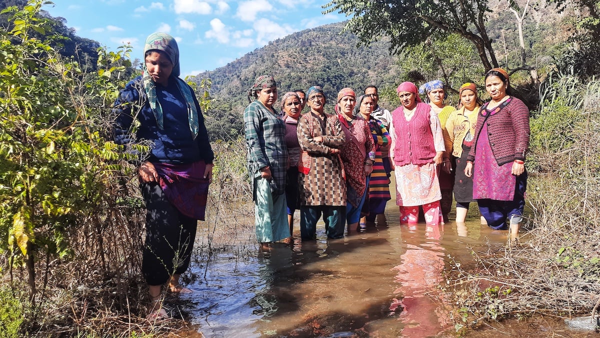 Women from Lohari village stand in the rising waters of the lake created for the Lakhwar-Vyasi project, Varsha Singh