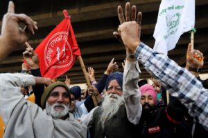 <p>Farmers celebrate following news in December 2021 that the Indian government agreed to repeal three contentious laws in the agricultural sector (Image: Alamy)</p>