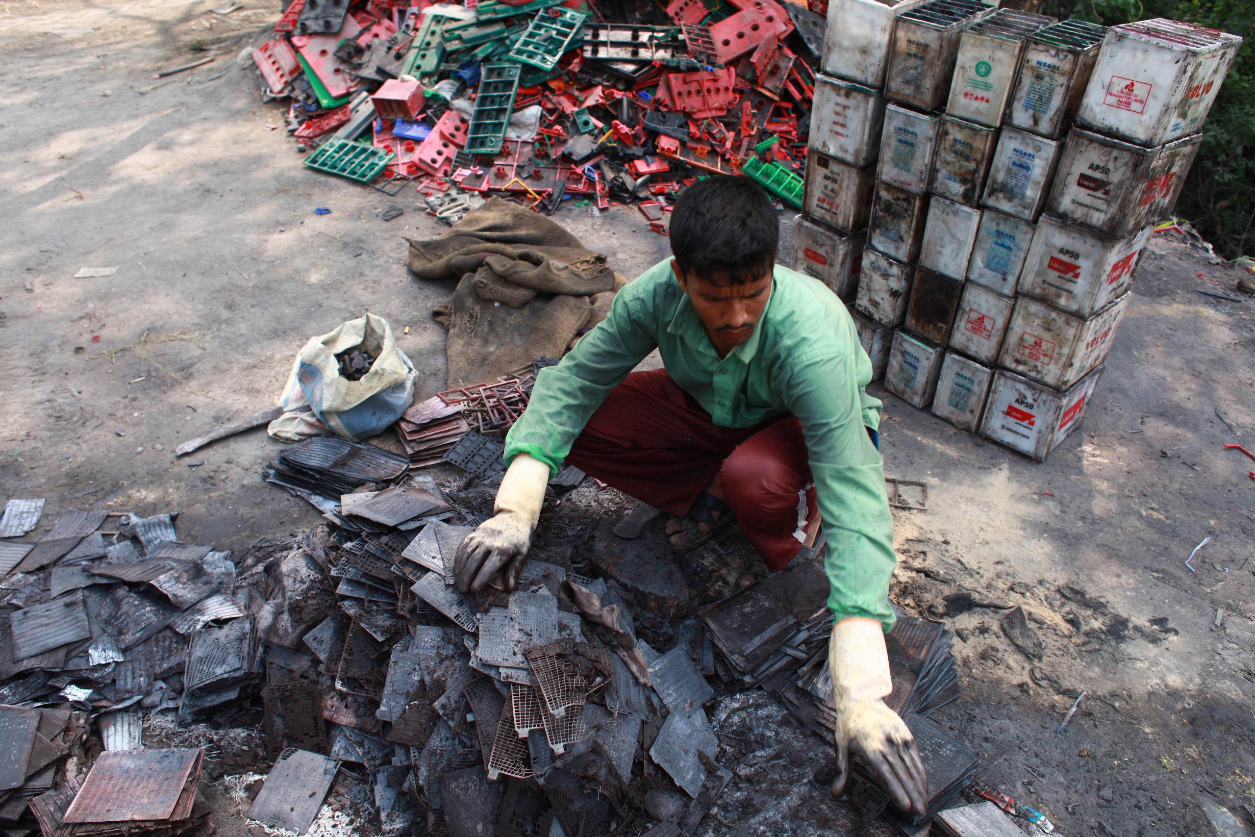 A man sorts batteries in Dhaka, Bangladesh