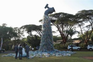 sculpture depicting flowing tap made from plastic bottles