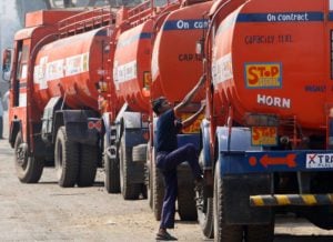 <p>Lorries carry fuel into Mumbai (Image: Arko Datta / Reuters / Alamy)</p>