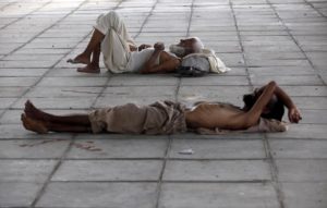 Men sleep in shade during a heatwave in Karachi, Pakistan, June 2015