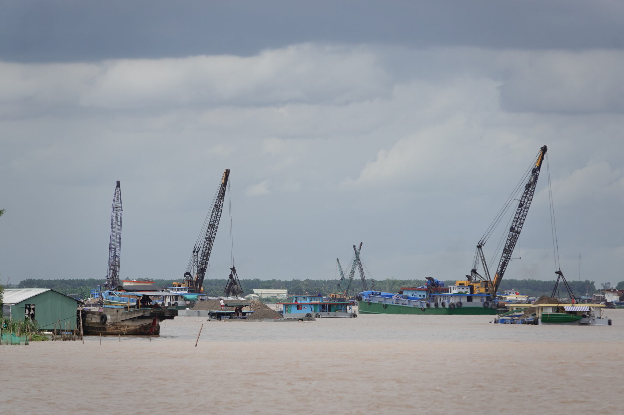 Sand dredgers on the Hau River in An Giang province, Vietnam