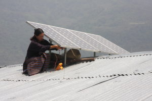 <p>A woman installs solar panels on a roof in Bhutan (Image: Asian Development Bank / <a href="https://www.flickr.com/photos/asiandevelopmentbank/9386865583/">Flickr</a> / <a href="https://creativecommons.org/licenses/by-nc-nd/2.0/">CC BY-NC-ND 2.0</a>)</p> <h2></h2>